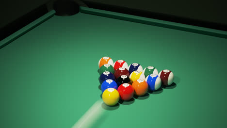 Colorful-billiard-balls-on-the-green-baize-of-a-billiard-table,-waiting-for-the-game-start.-Breaking-the-rack-in-the-pool.-A-strong,-professional-shot-of-cue-ball.