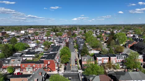 Charming-american-neighborhood-with-main-street-during-sunny-day-with-blue-sky