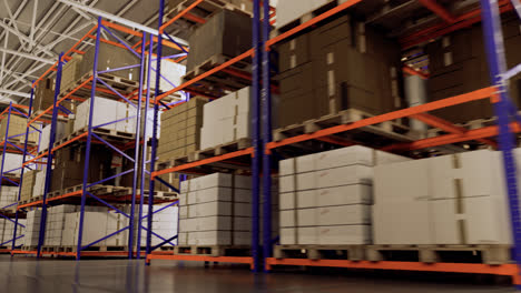 Camera-tracking-back-between-the-shelves-in-the-warehouse-in-the-modern-industrial-storage-building.-Long-shelves-with--different-size-boxes-and-containers.-Background-for-logistics,-distribution.-4k