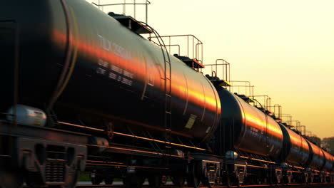 Loopable-animation-of-a-tank-wagons-during-sunset.-Bright-sun-reflected-on-the-wagon-surface.-Heavy-metal-carriages-are-used-for-transport-liquid-chemicals-like-petrol.