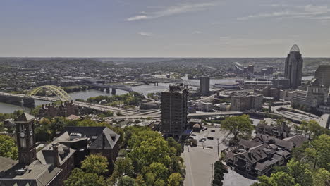 Cincinnati-Ohio-Aerial-v78-flyover-Mt-Adams-neighborhood-capturing-hilltop-views-of-downtown-cityscape,-Newport-and-Bellevue-Kentucky-across-the-river---Shot-with-Mavic-3-Pro-Cine---September-2023