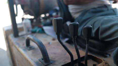 Close-up-of-a-man's-hand-pulling-on-a-forklift-handle