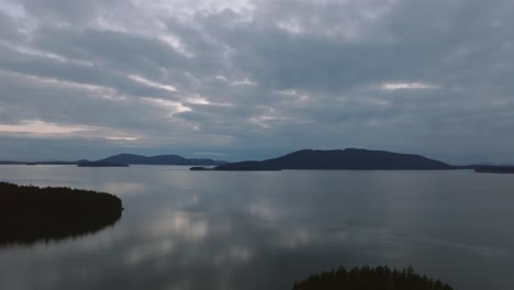 Wide-pushing-in-shot-of-the-Bellingham-Bay-in-Washington-State-during-a-cloudy-sunset