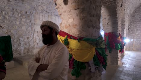 Spiritual-leader-of-the-Yazidi-council-in-the-sacred-temple-at-Lalish,-Kurdistan-Iraq