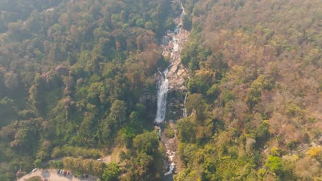 4K-aerial-drone-footage-of-Wachirathan-Waterfall,-Chiang-Mai,-Thailand,-Asia