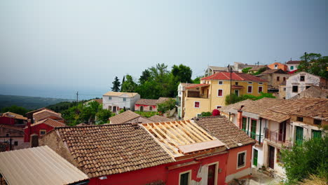 Walking-through-the-narrow-streets-of-Lakones-mountain-village-in-Corfu,-Greece