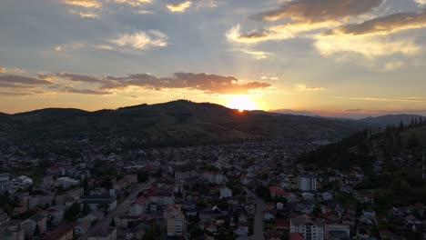 Drone-shot-of-sunset-in-Gura-Humorului,-Suceava