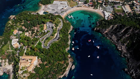 Aerial-drone-shot-over-the-picturesque-rocky-coastline-of-Paleokastritsa-bay-in-Corfu,-Greece