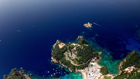 Aerial-drone-shot-over-the-picturesque-rocky-coastline-of-Paleokastritsa-bay-in-Corfu,-Greece