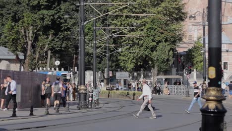 A-public-pedestrian-area-with-a-tram-passing-by-in-Istanbul,-Turkey