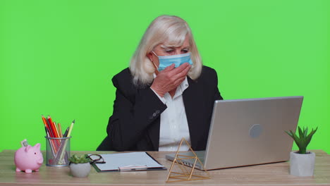 Sick-senior-businesswoman-wears-medical-face-mask-coughing-suffering-from-bronchitis-asthma-allergy