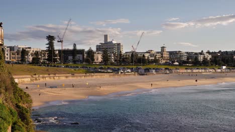 Medium-shot-of-construction-cranes-over-Bondi-Beach-at-sunrise