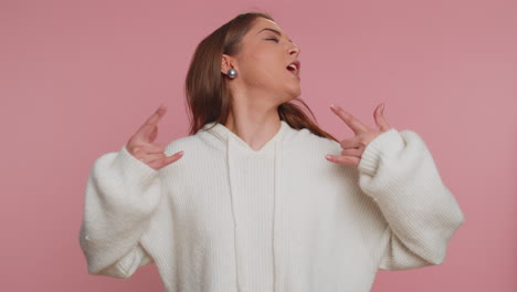 Overjoyed-happy-woman-showing-rock-n-roll-gesture-by-hands,-cool-sign,-shouting-yeah-with-crazy-face