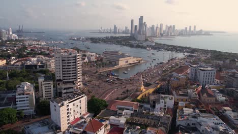 Aerial-View-of-Cartagena,-Colombia,-Old-Town,-Coastal-Traffic-and-Bocagrande,-Drone-Shot