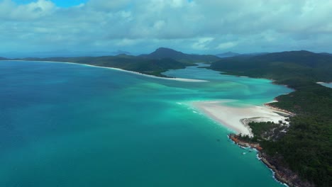 Hill-Inlet-Lookout-aerial-drone-scenic-flight-Whitsundays-Island-North-end-Whitehaven-beach-QLD-Australia-boats-tourists-Port-of-Airlie-National-Park-clear-turquoise-ocean-water-sun-cloudy-forward-pan