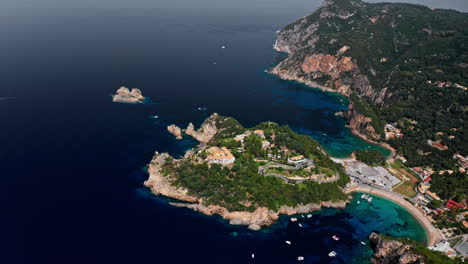 Aerial-drone-shot-over-the-picturesque-rocky-coastline-of-Paleokastritsa-bay-in-Corfu,-Greece