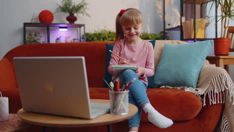 Online-education-on-laptop-of-little-child-girl-at-home-virtual-class,-modern-distance-e-learning