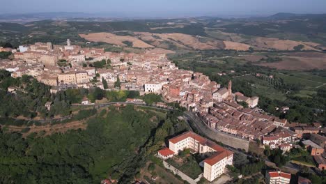 Aerial-drone-flying-above-the-old-European-rural-town-of-Montepulciano-in-Tuscany,-Italy