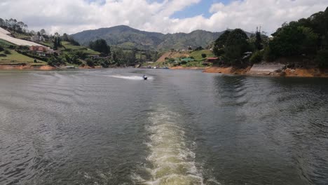 Sailing-on-Guatape-Lake,-Colombia,-Wake-of-Boat-and-Landscape