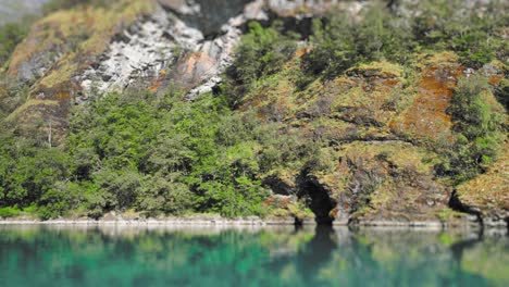 Beautiful-footage-of-a-lake-with-turquoise-waters-and-rocky-shores