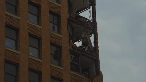 A-close-up-of-the-demolition-process-of-an-ornate-high-rise-building-in-Youngstown,-Ohio