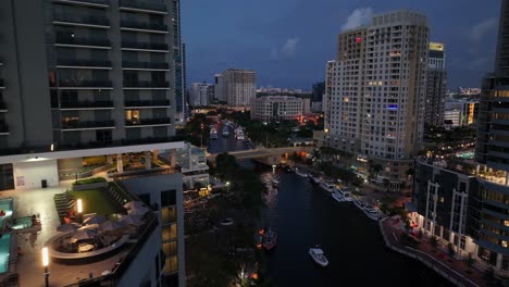 Tourist-in-rooftop-Swimming-pool-of-Skyscraper-Hotel-in-Fort-Lauderdale-City-at-night