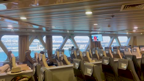 Passengers-relaxing-on-a-ferry-crossing-the-Mediterranean-Sea,-views-of-Mallorca