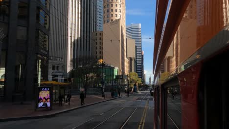 San-Francisco,-California-USA,-Riding-on-Tram-on-Market-Street,-Out-of-Window-POV-of-Buildings