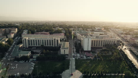 Uzbekistan-flagpole-with-Uzbek-flag,-Samarkand-Aerial