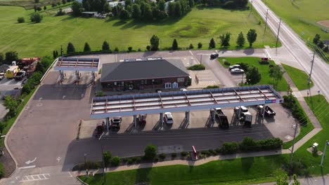 Aerial-Establishing-Shot-Above-Speedway-Gas-Station-in-Rural-Neighborhood-during-Daytime