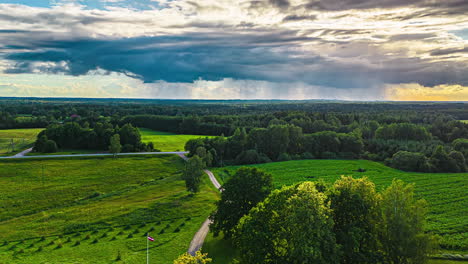 Rainy-weather-over-farmland-fields---pullback-aerial-hyper-lapse-reveal