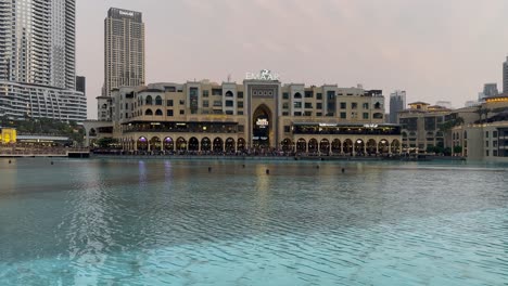 UAE-tourists-stroll-along-Burj-Khalifa-Lake-in-front-of-Emaar-building