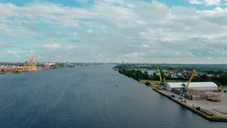 Aerial-harbor-view-above-river-when-flying-sideways