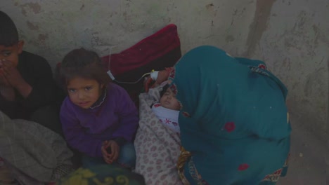 A-poor-Afghan-family-with-children-and-a-newborn-and-widow,-living-in-a-bad-situation-and-looking-for-assistance,-Oprhan-in-need-with-family