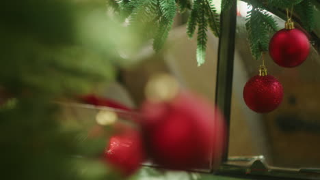 detail-of-Christmas-tree-red-glass-balls-baubles,-globes,-ornament-decoration-for-winter-holiday-celebration-at-home