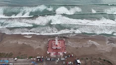 Tourist-monument-La-Serena-Monumental-Lighthouse-and-parked-vehicles-located-in-the-city-of-La-Serena,-Chile