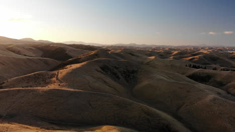 4K-Drone-shot-over-mountains-or-dunes-in-New-Zealand-during-sunset