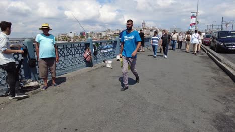 People-and-visitors-on-the-Galata-Bridge-in-Istanbul,-Turkey