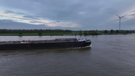 Motor-Tanker-Navigating-On-River-On-Cloudy-Sunset-In-Barendrecht,-Netherlands