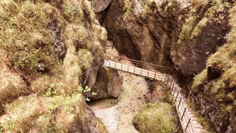 Aerial-view-of-the-Almbachklamm-waterfall-in-Garmisch-Partenkirche-during-summer-showcases-the-vibrant-display-of-colorful-foliage