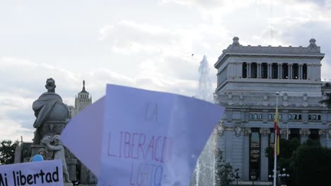 LGBTQ+-protest-featuring-Spanish-slogans,-highlighting-activism-and-diversity