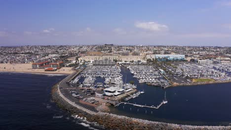 Aerial-descending-close-up-shot-of-the-King-Harbor-Yacht-Club-in-Redondo-Beach,-California