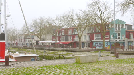 Profile-view-of-"Le-Gabut"-district,-Scandinavian-style-in-La-Rochelle,-France-on-a-cloudy-day