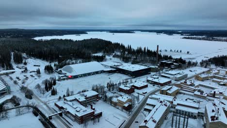 Arial-view-around-the-Grand-hall-and-Sports-and-Fair-Centre,-winter-sunset-in-Lahti,-Finland