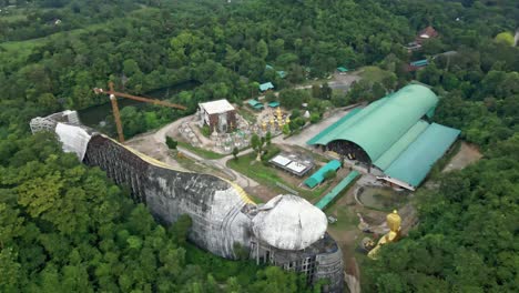 Reclining-Buddha-Statue-from-Behind-in-Saraburi-Province,-Thailand