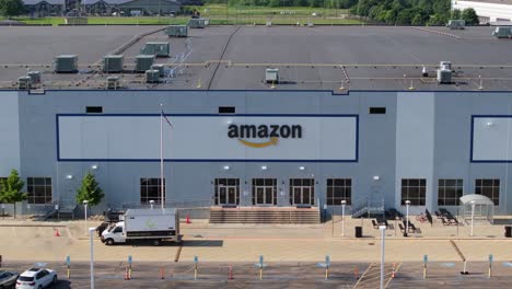 Telephoto-aerial-dolly-to-Amazon-warehouse-distribution-goods-across-region