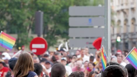 LGBTQ+-pride-protest-featuring-many-rainbow-flags,-showcasing-solidarity-and-activism