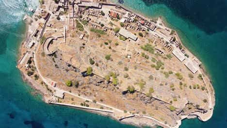 Rotating-Top-View-over-Venetian-Spinalonga-Fortress-Island-in-Crete,-Greece