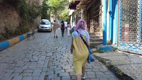 People-are-walking-towards-Galata,-formerly-known-as-the-Karaköy-neighborhood,-located-on-the-northern-shore-of-the-Golden-Horn-in-Istanbul