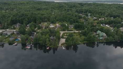 Aerial-View-Lakeshore-Houses-Village-On-Sherbrooke,-Eastern-Shore-Of-Nova-Scotia,-Canada,-In-Guysborough-County